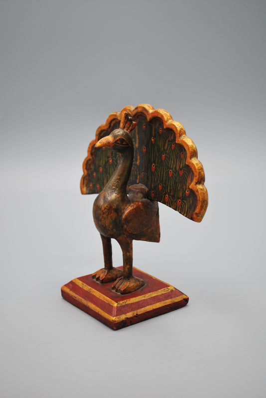 Small wooden peacock
