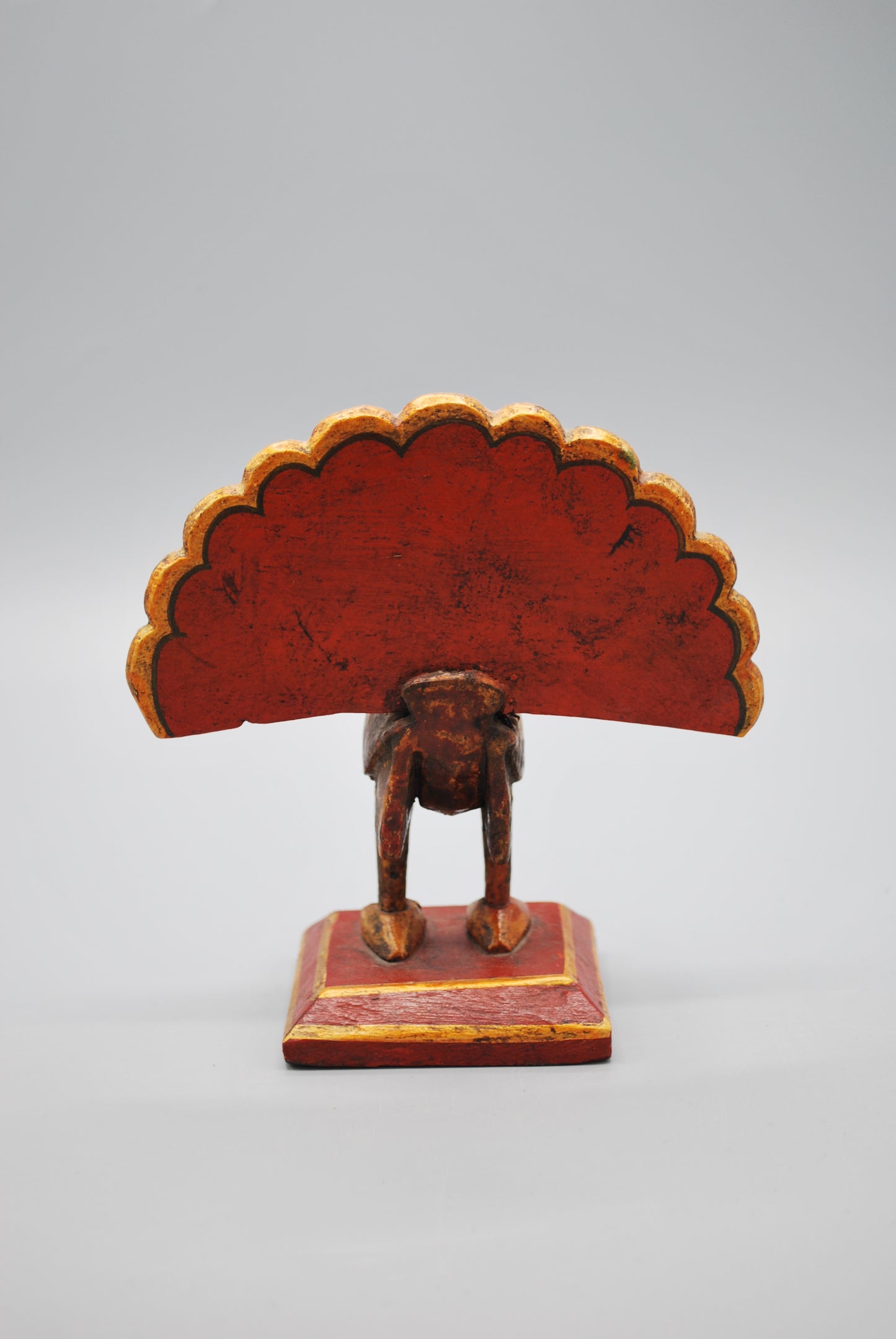 Small wooden peacock