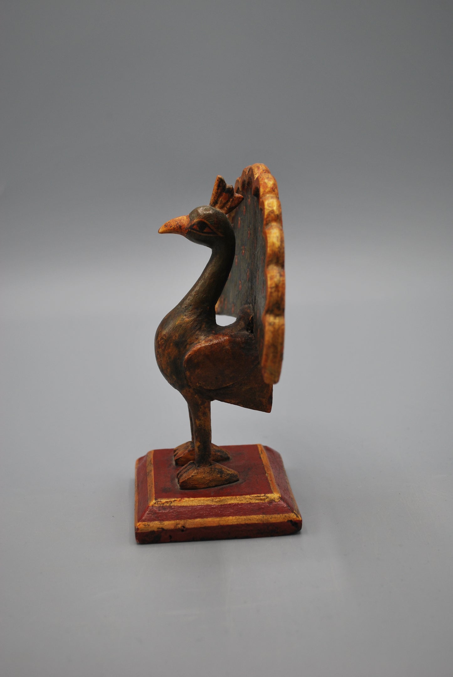 Small wooden peacock