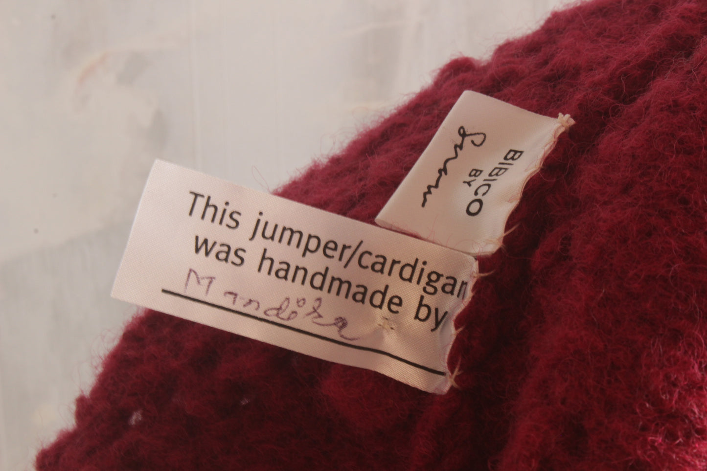 Pure wool hand knitted raspberry cardigan